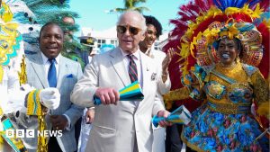 King dances within the streets of the Bahamas capital