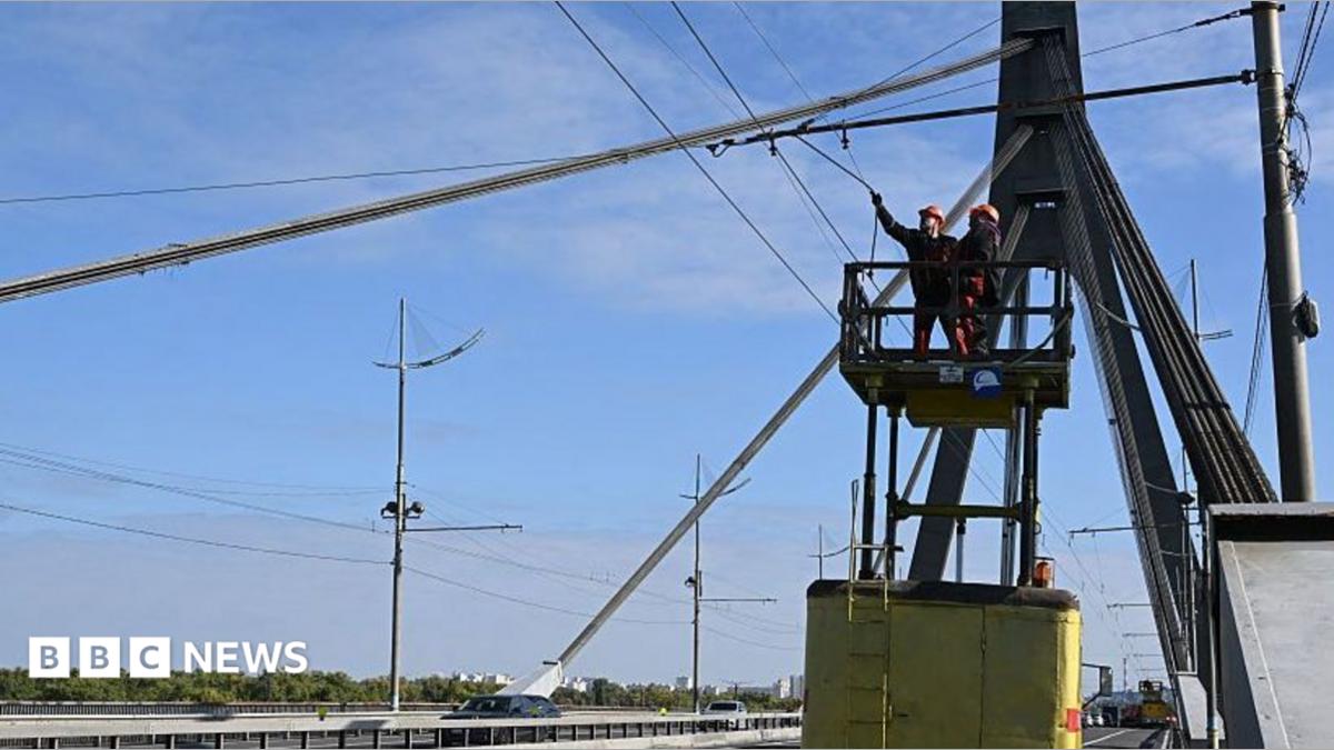 Kyiv bridge hit in additional drone assault as German chancellor makes shock go to